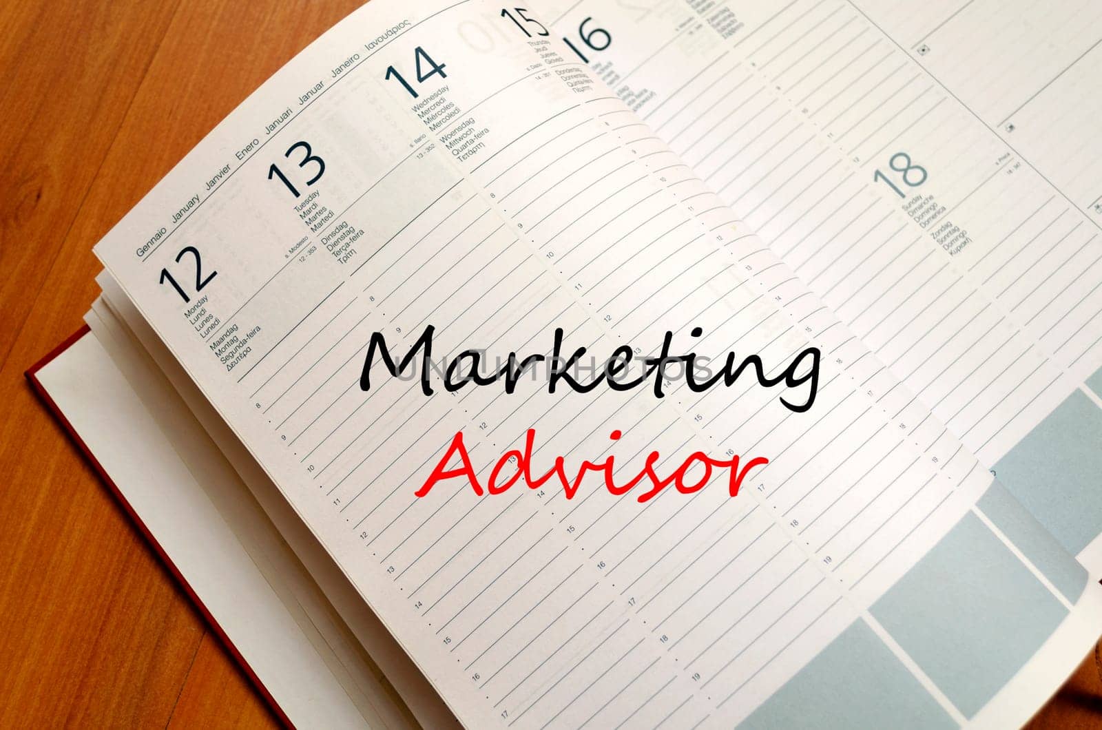 Marketing advisor text concept write on notebook