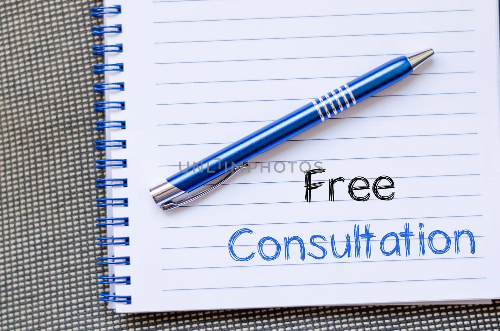 Free consultation text concept write on notebook