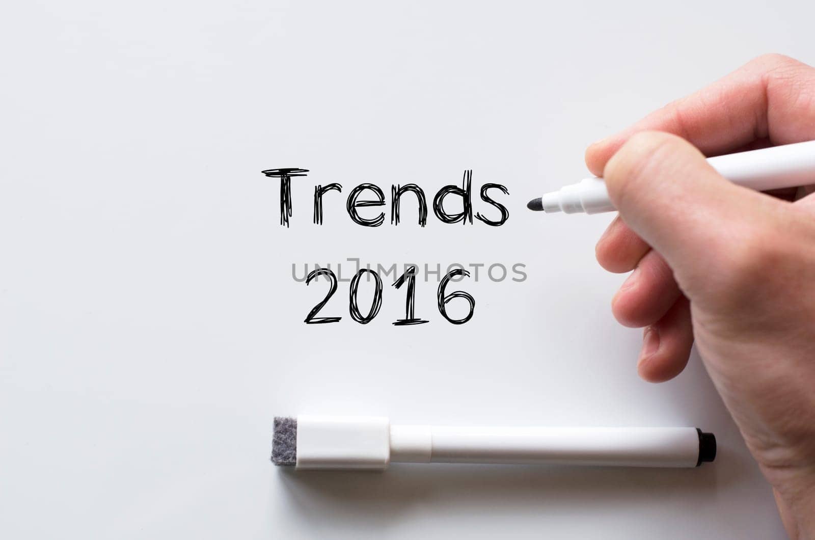 Human hand writing trends 2016 on whiteboard