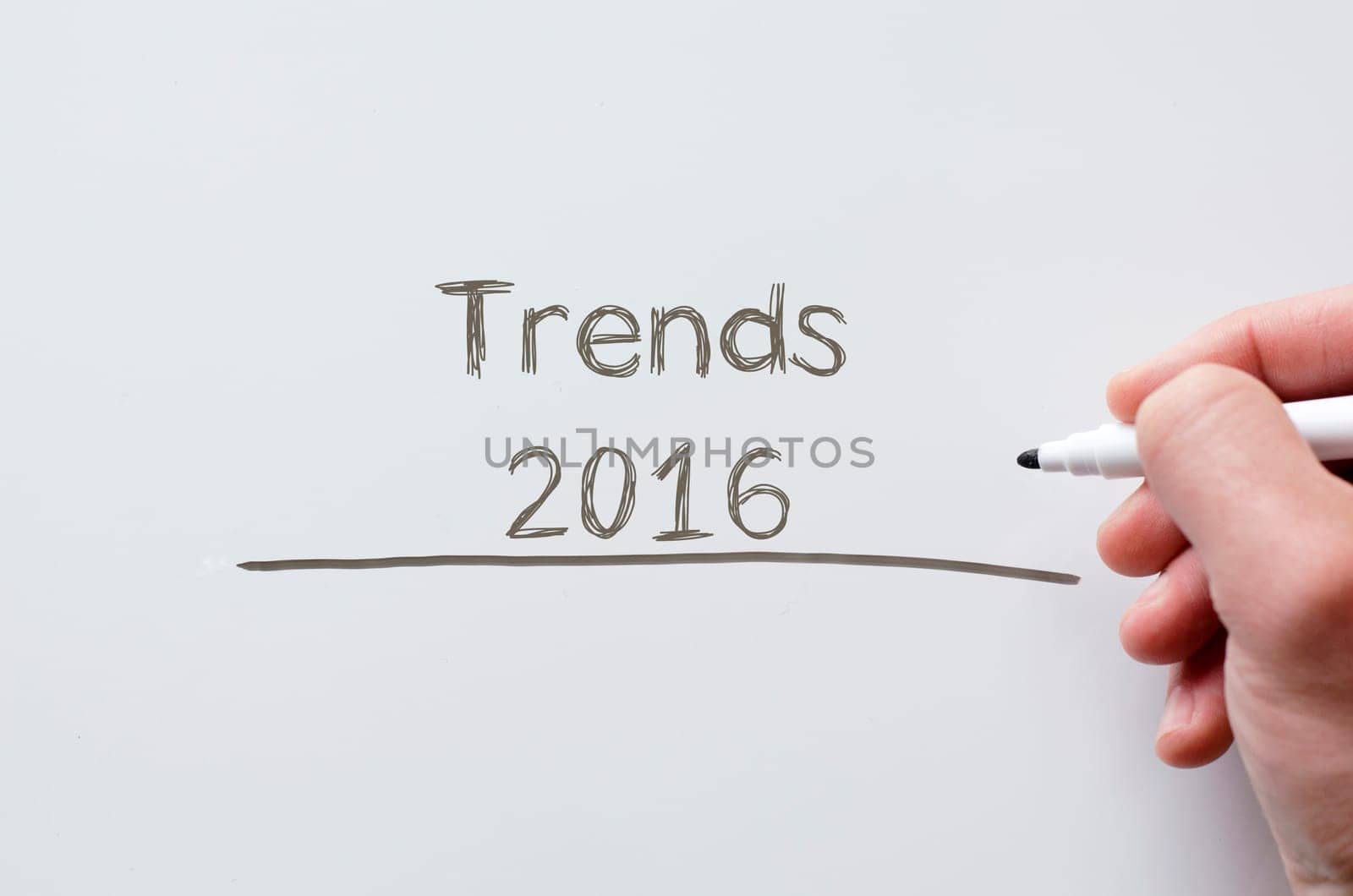 Human hand writing trends 2016 on whiteboard