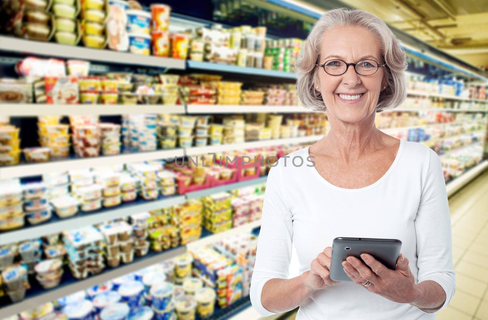 Woman in departmental store choosing items from tablet pc