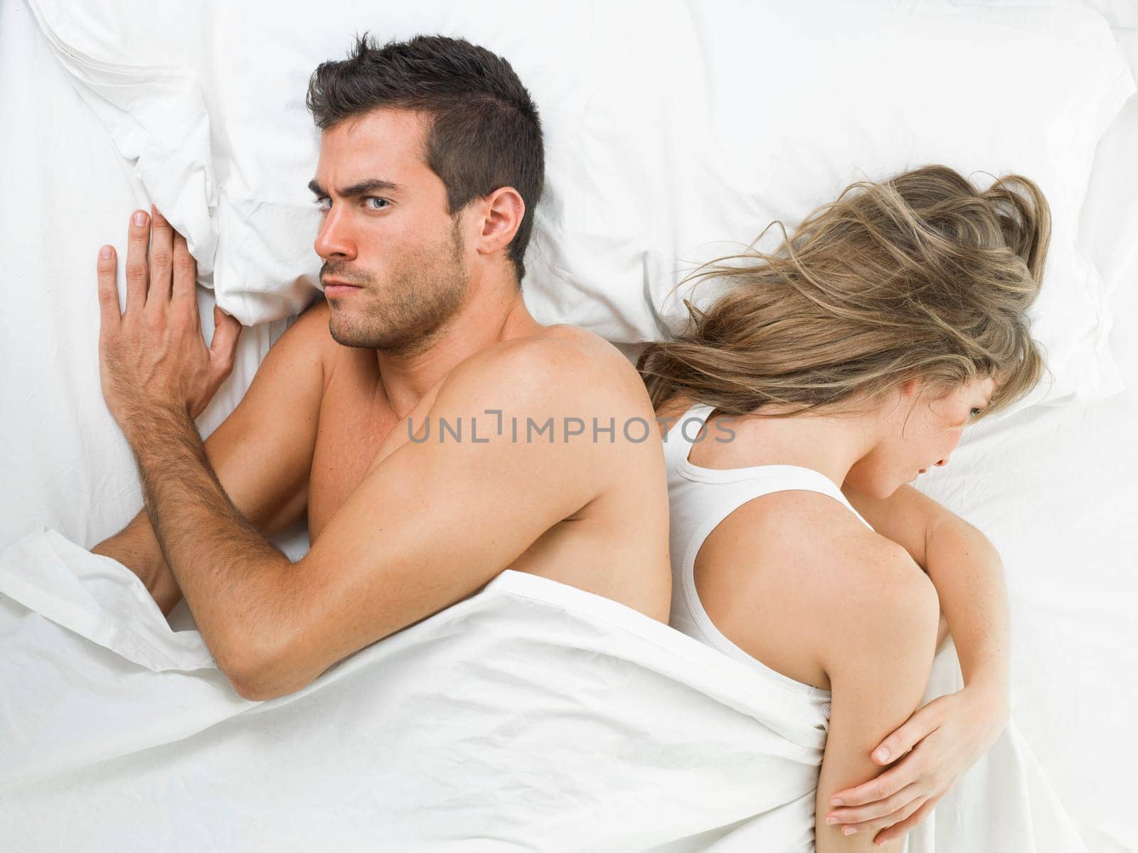 non communicative offended couple goes to sleep unhappy