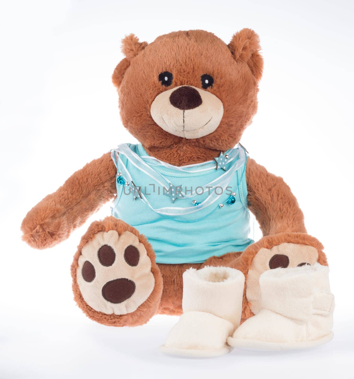 Teddy bear with blue shirt and ribbon and shoes, isolated on white background