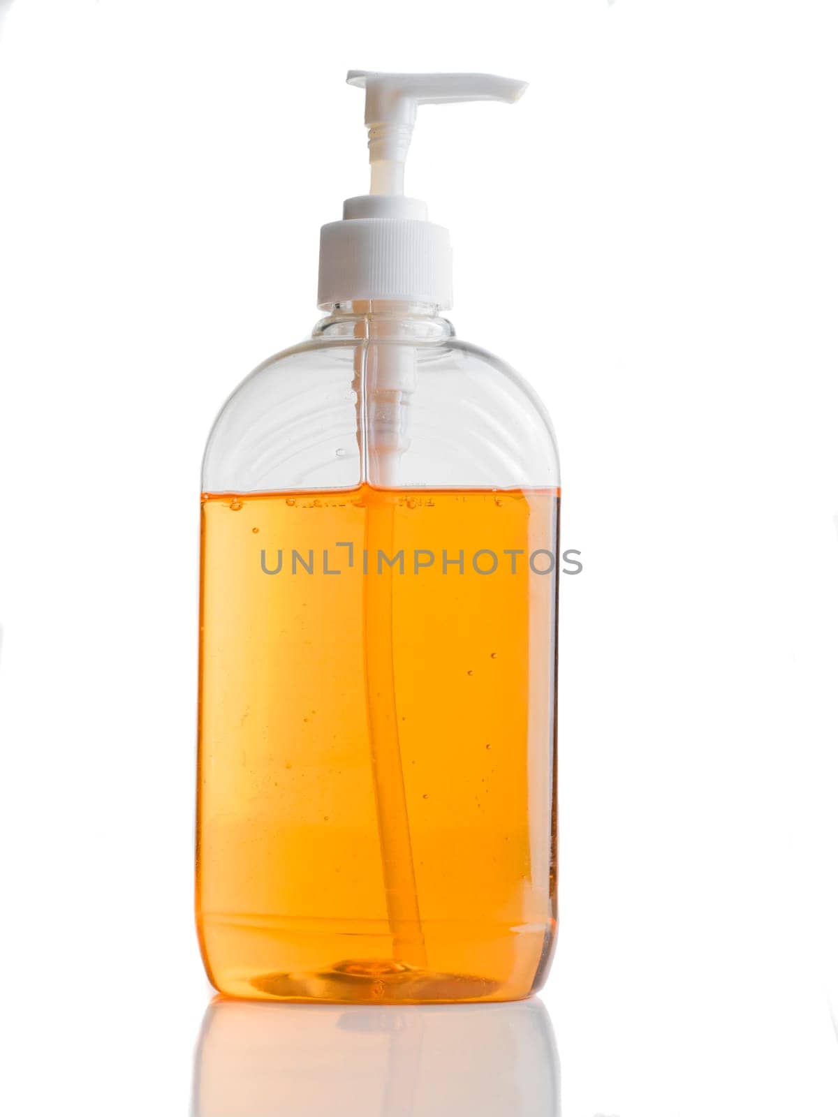 orange hand soap bottle in a wihte background