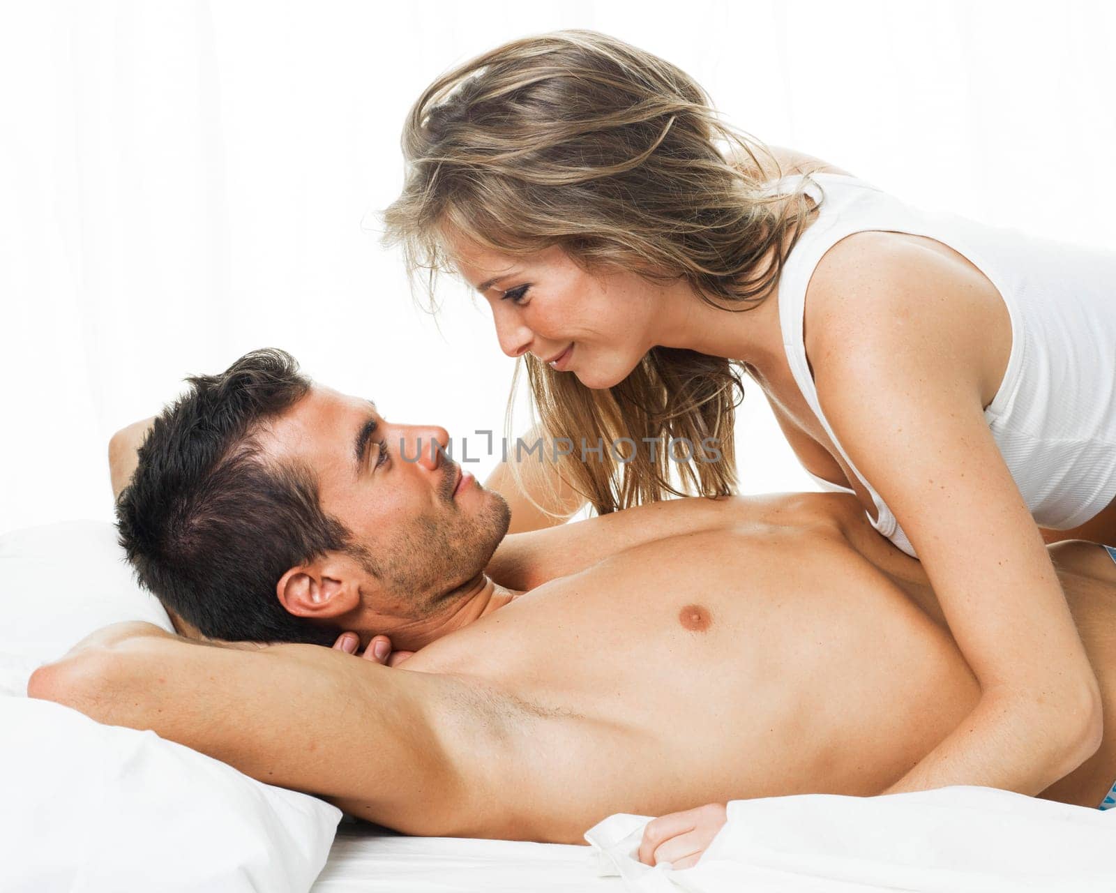 a man and a woman foreplaying in a white background