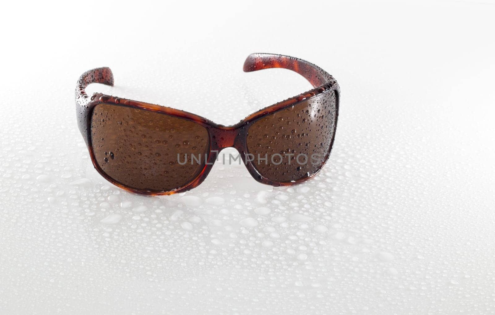 wet sunglasses isolated on white background