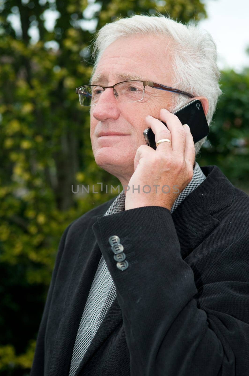 Businessman using a smartphone while being outside