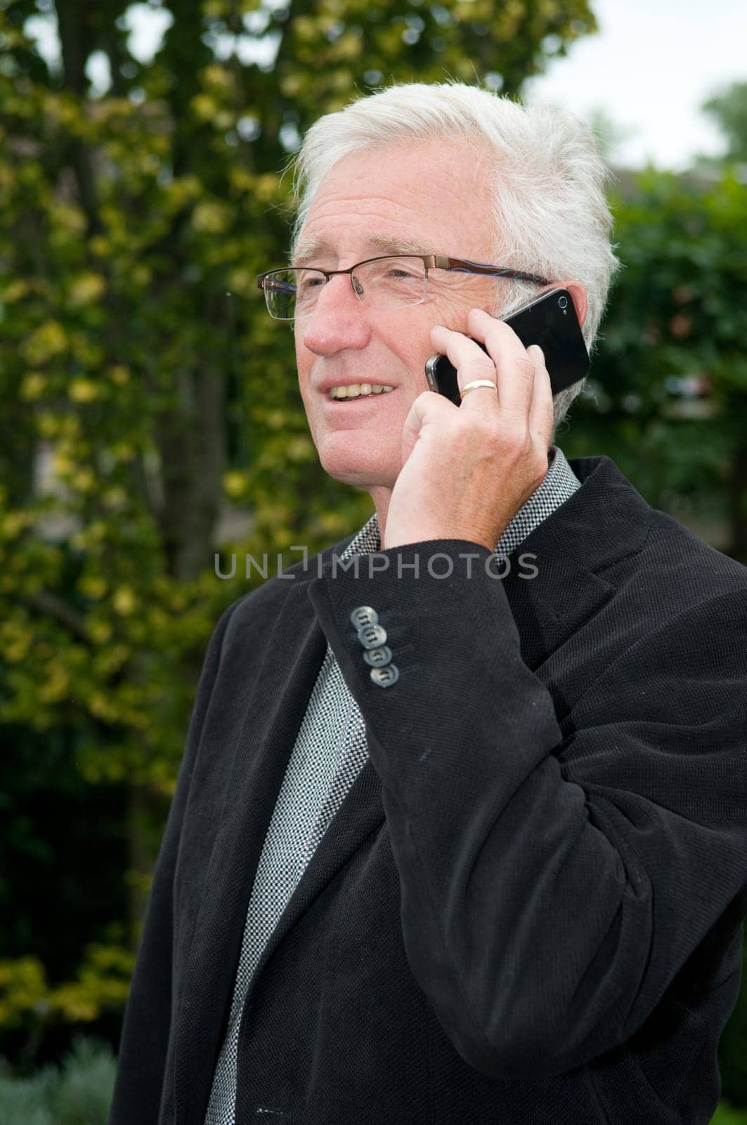 Businessman using a smartphone while being outside