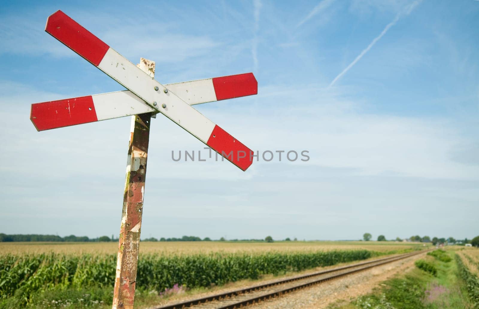 An old railway sign near a small railway in Holland, Netherlands.