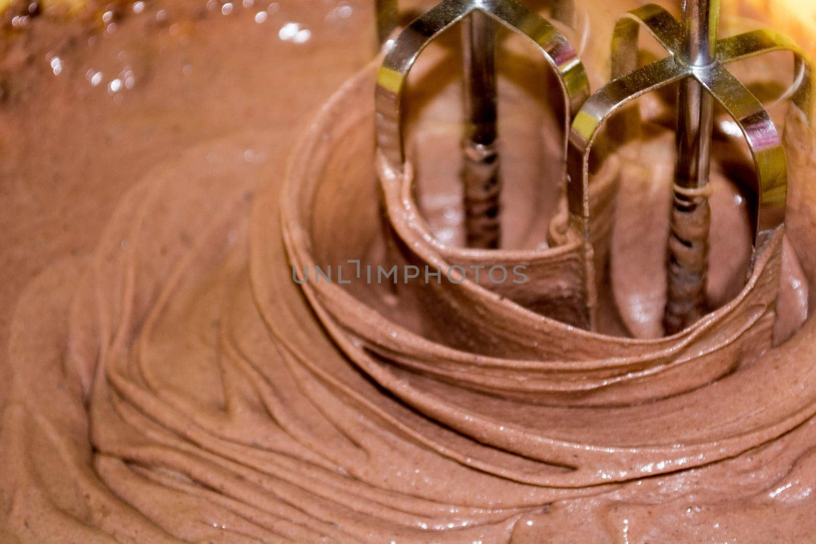 Mixing chocolite for cake with electric mixer