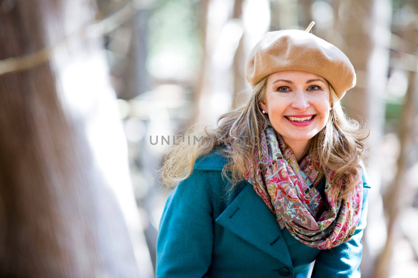 blond casual woman happy outdoors in the woods