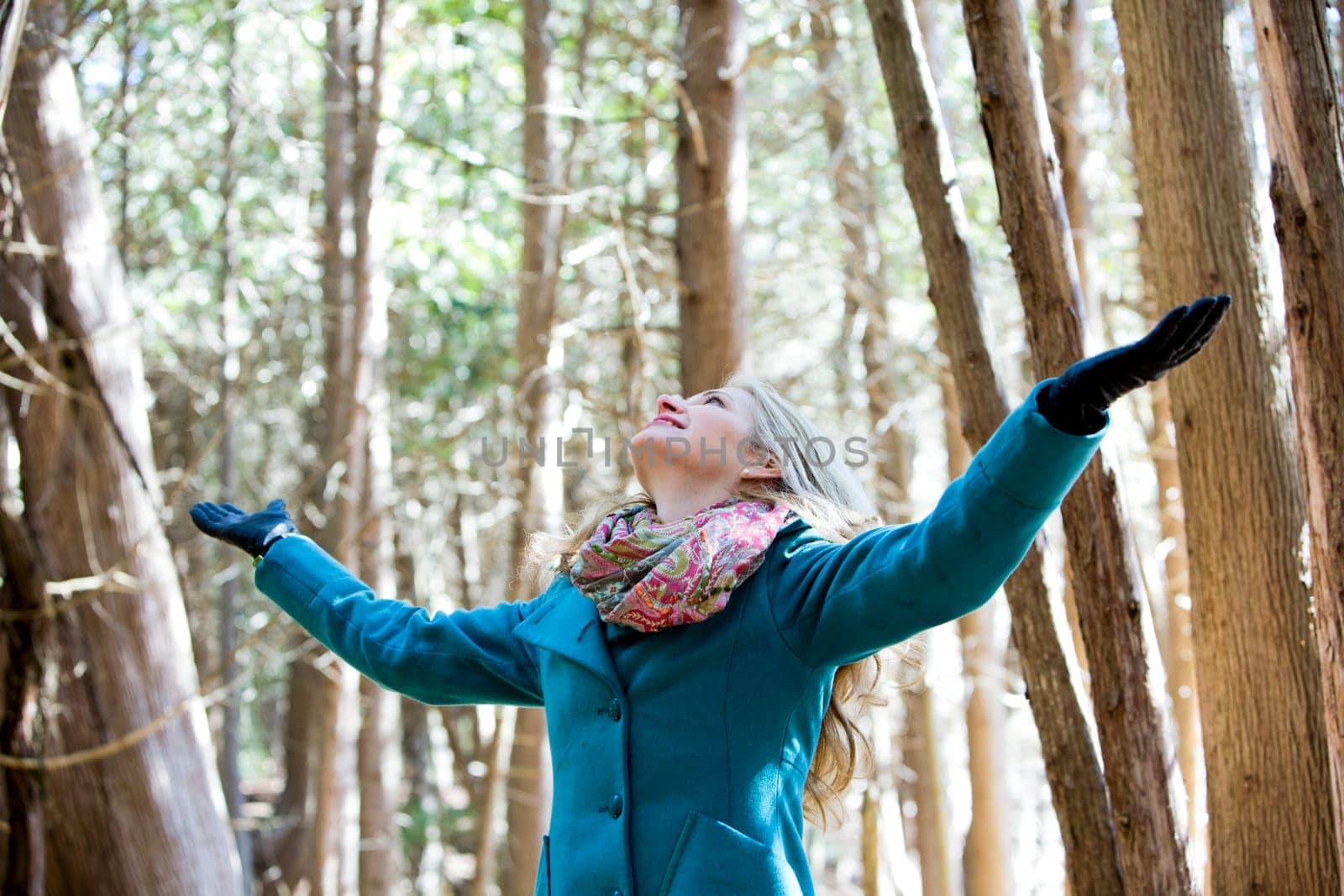 blond casual woman happy outdoors in the woods