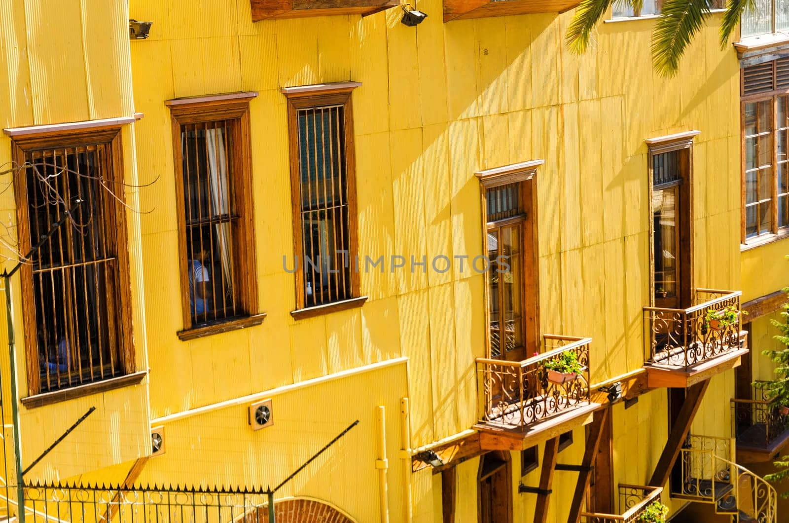 Facade of a yellow building in Valparaiso, Chile
