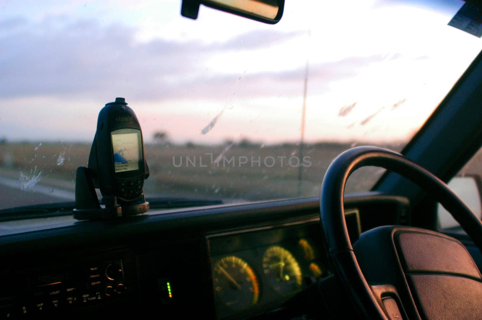 Inside a car with GPS in the Australian outback sunset