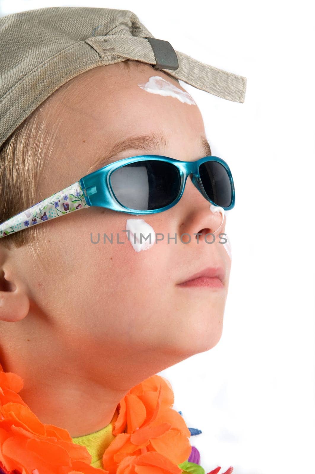 Cute summer holiday picture of a boy with hat and sunglasses.