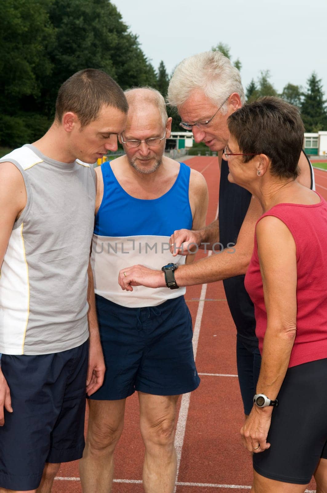 Group of athletes discussing their just finished run
