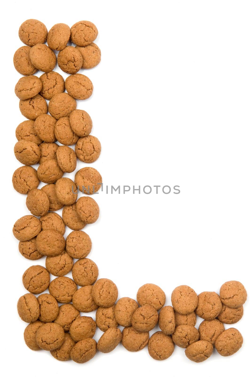Little ginger nuts in the form of the letter L. These little ginger nuts are used in Holland for the "Sinterklaas"" party, which is at Dec 5 every year. Sinterklaas is a sort of Santa Claus. In Holland these ginger nuts are called ""pepernoot"". Isolated on white."