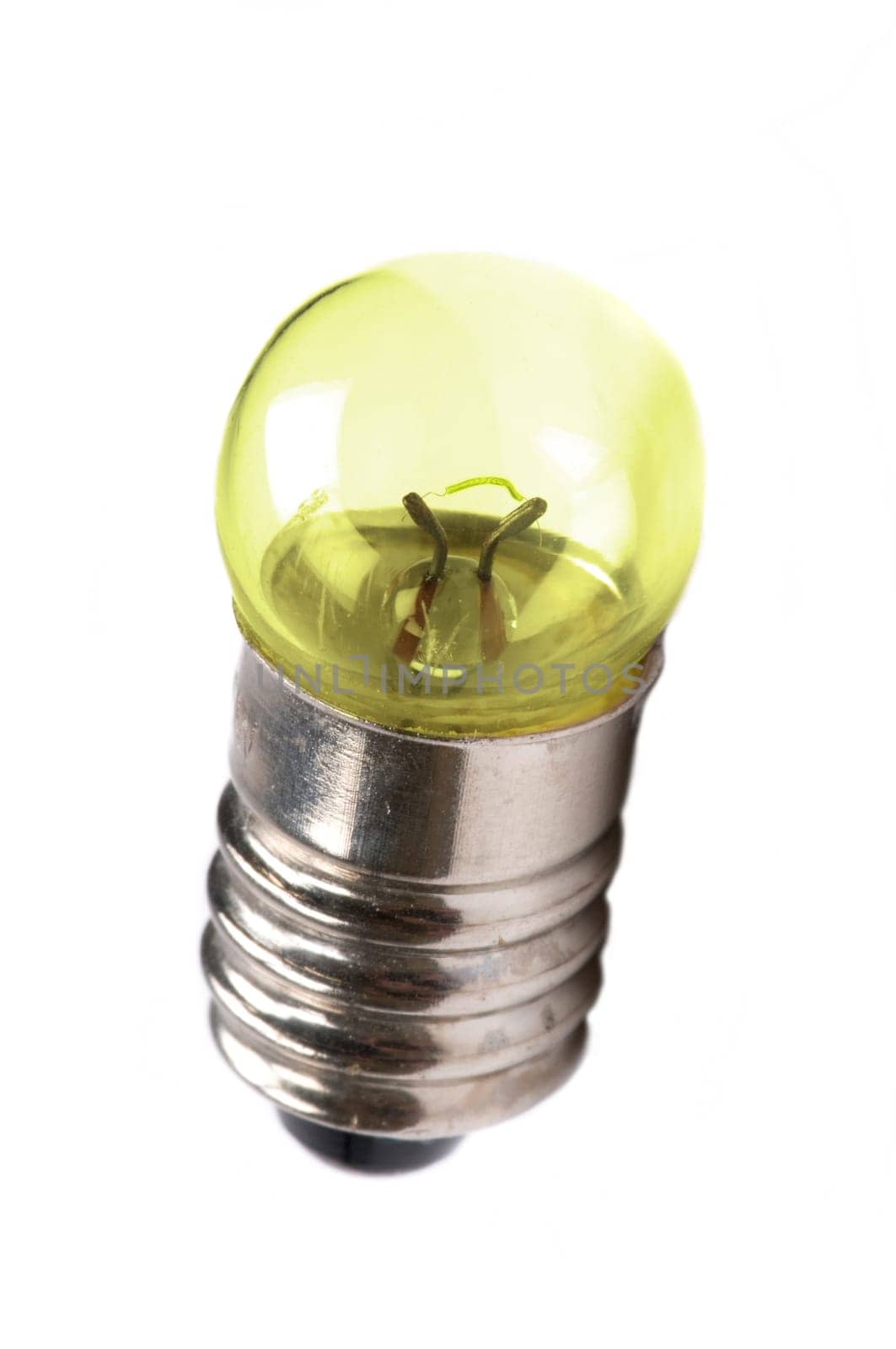 Macro image of a small light bulb giving light.
