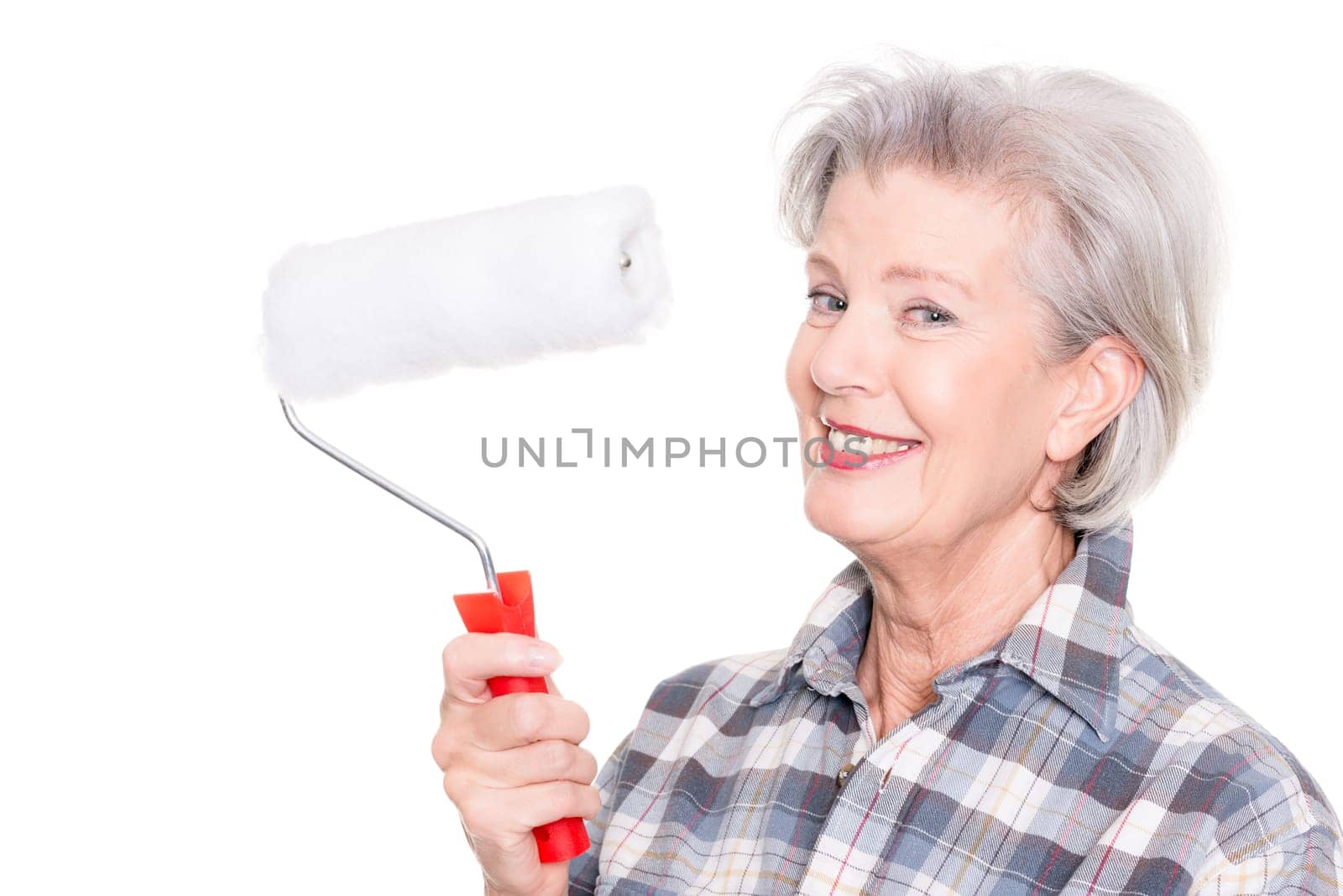 Studio shot of an elderly woman with a painter's role against a white background