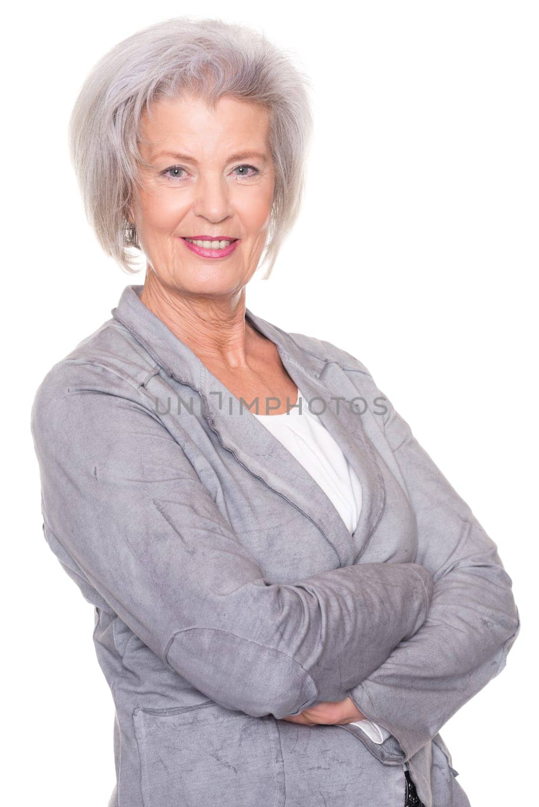 Studio recording of a smiling senior woman against a white background