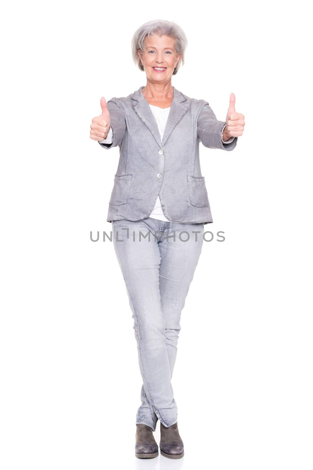 Studio recording of a smiling senior woman against a white background