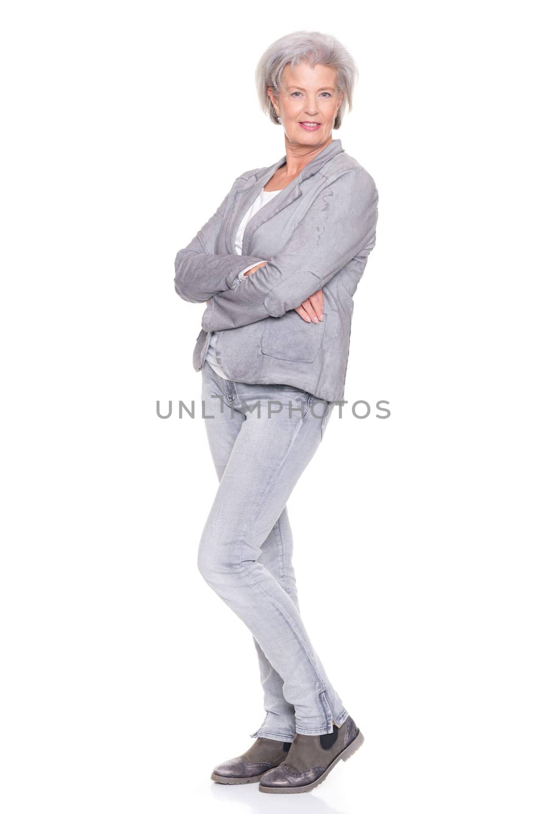 Studio recording of a smiling senior woman against a white background