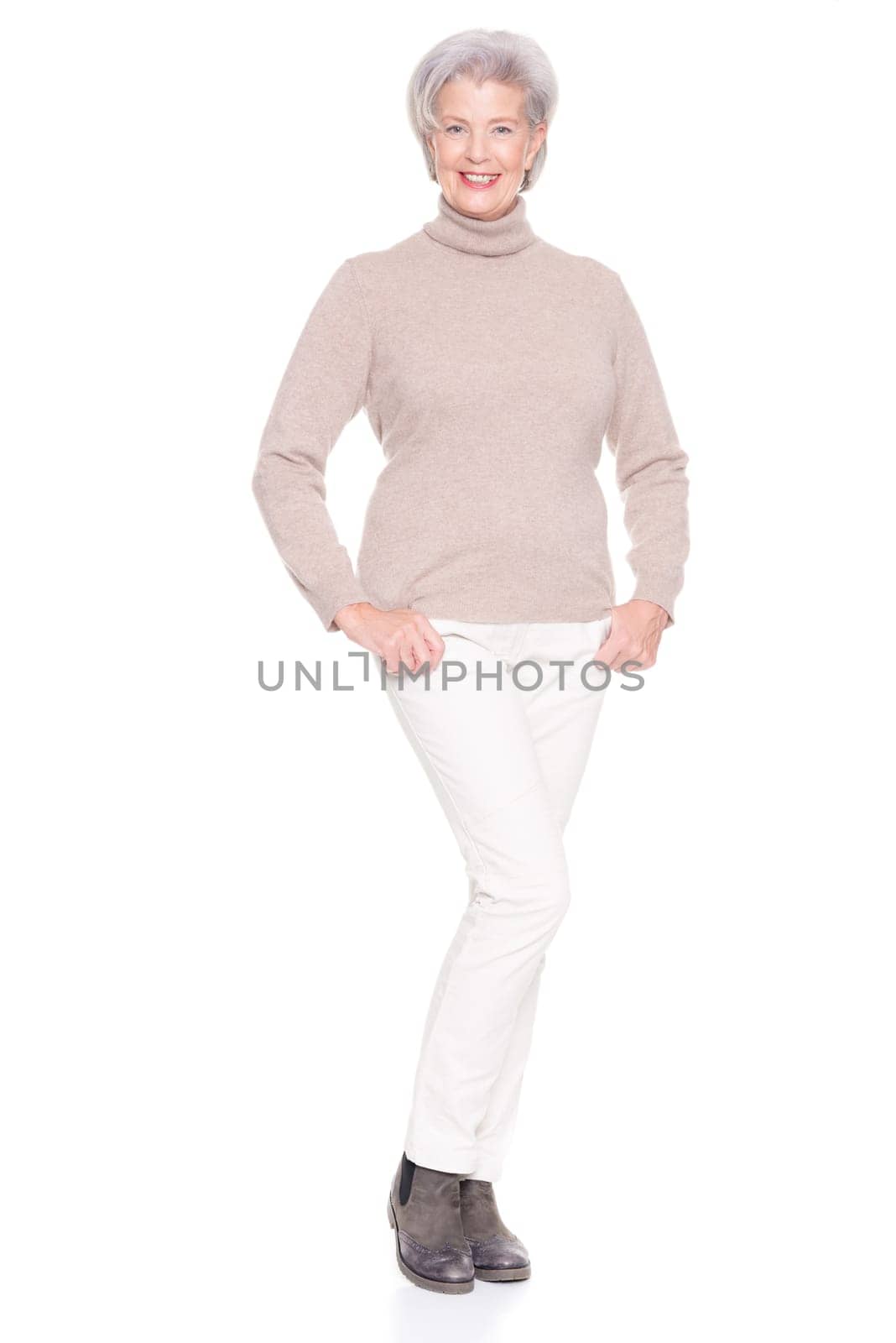 Studio recording of an active and happy senior against a white background
