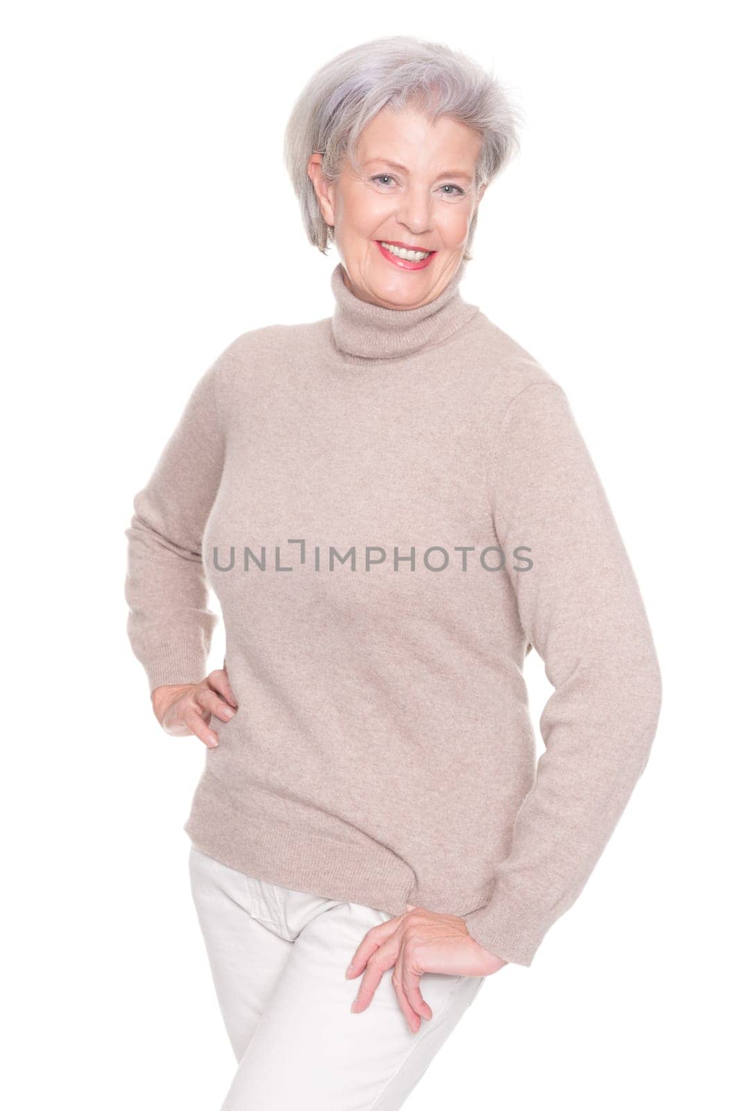 Studio recording of an active and happy senior against a white background