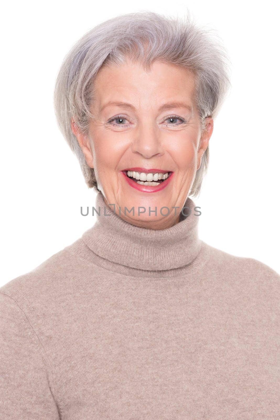 Studio recording of an active and happy senior against a white background