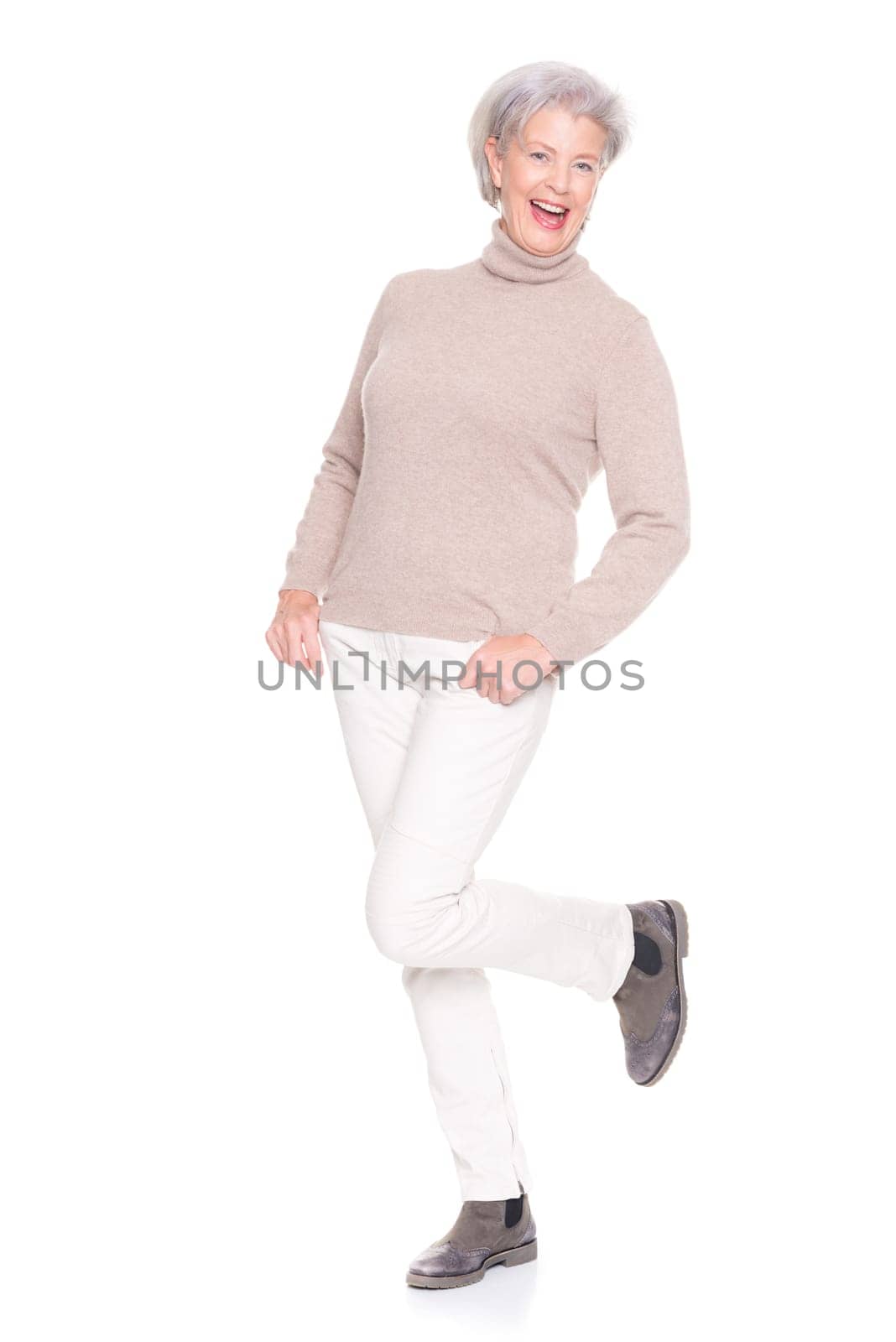 Studio recording of an active and happy senior against a white background