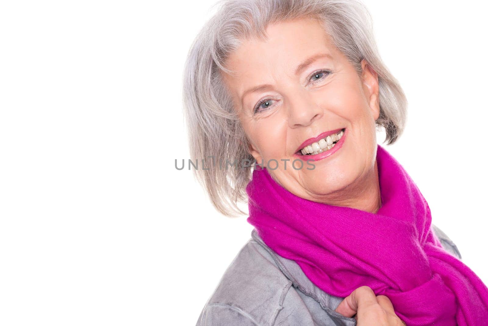 Studio recording of a smiling senior woman against a white background