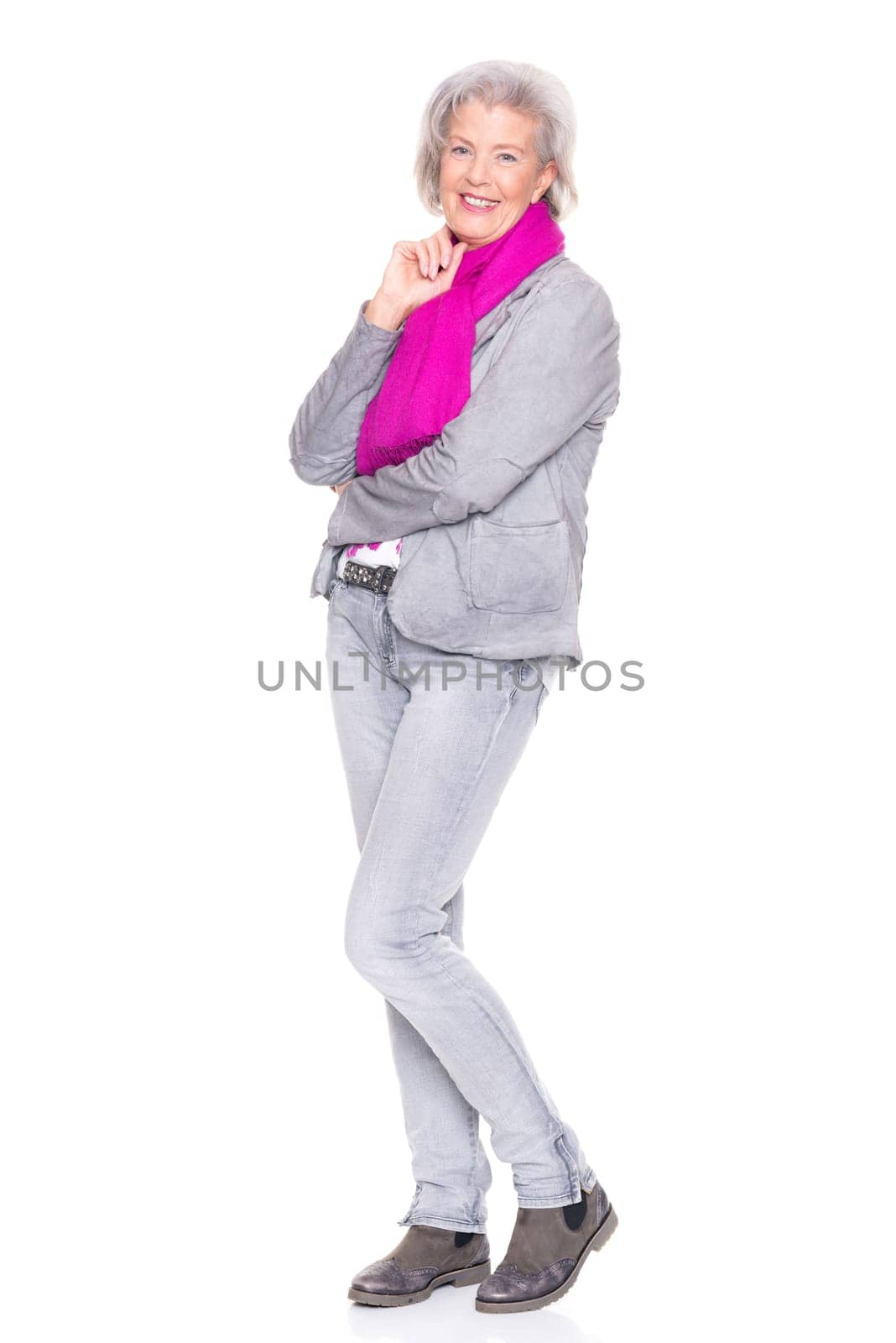 Studio recording of a smiling senior woman against a white background