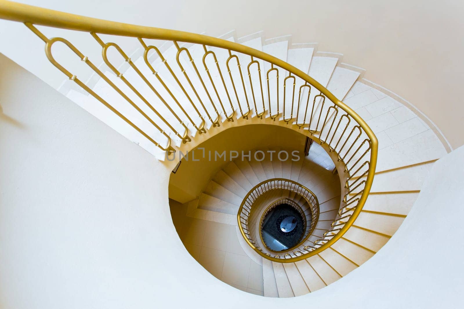 View from the top of a spiral staircase of an old Tuscan home