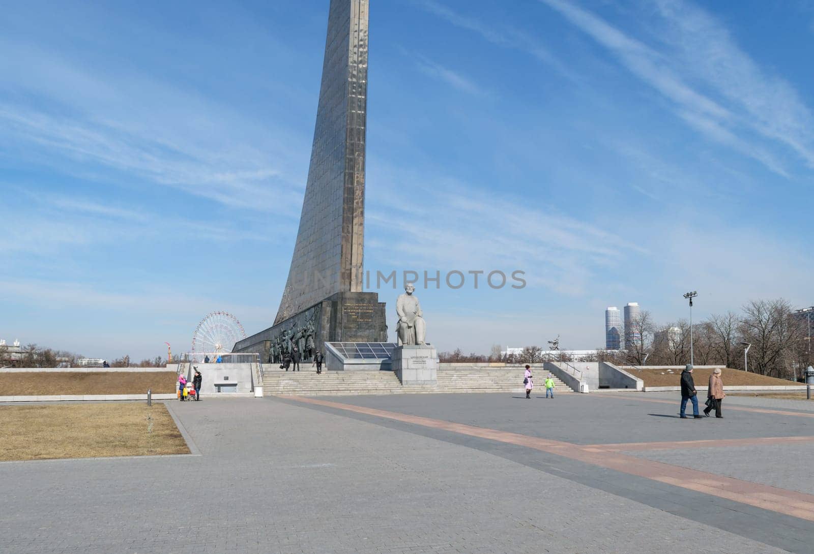 Moscow, Russia - March 29, 2016: People near the monument to the founder of astronautics Tsiolkovsky near the entrance of Memorial Museum of Cosmonautics on avenue of Cosmonauts