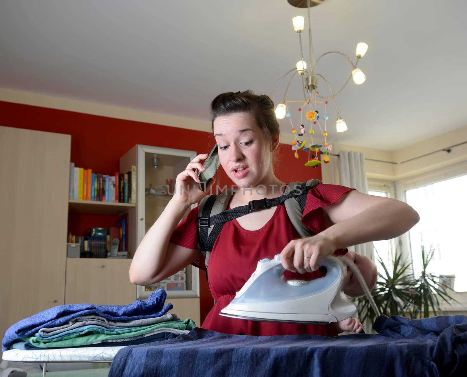 Mother with baby and smartphone