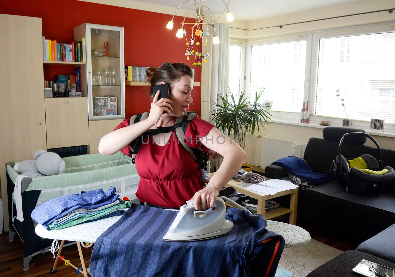 Mother with baby and smartphone