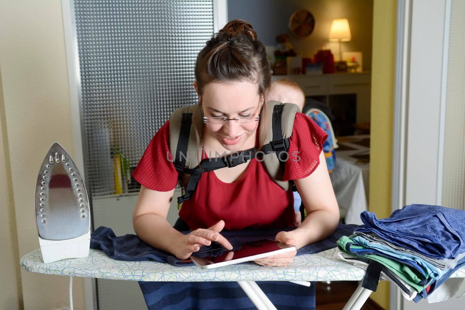 Mother with baby and digital tablet