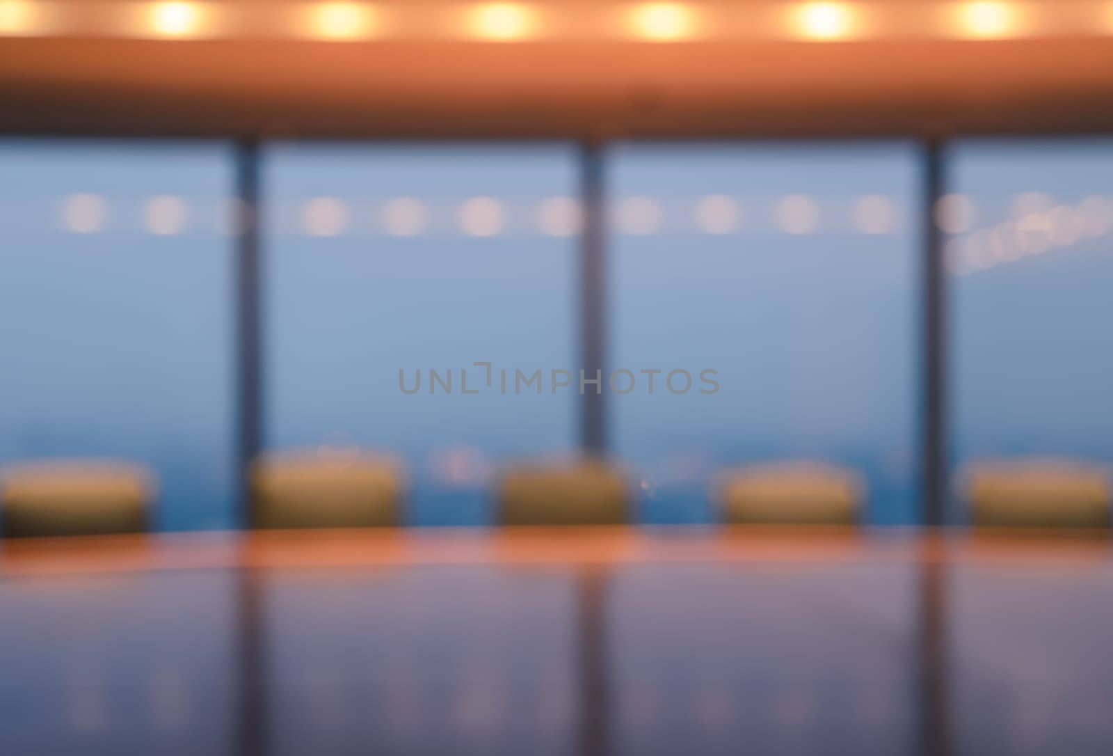 Blur image of empty boardroom with window cityscape background. Business concept
