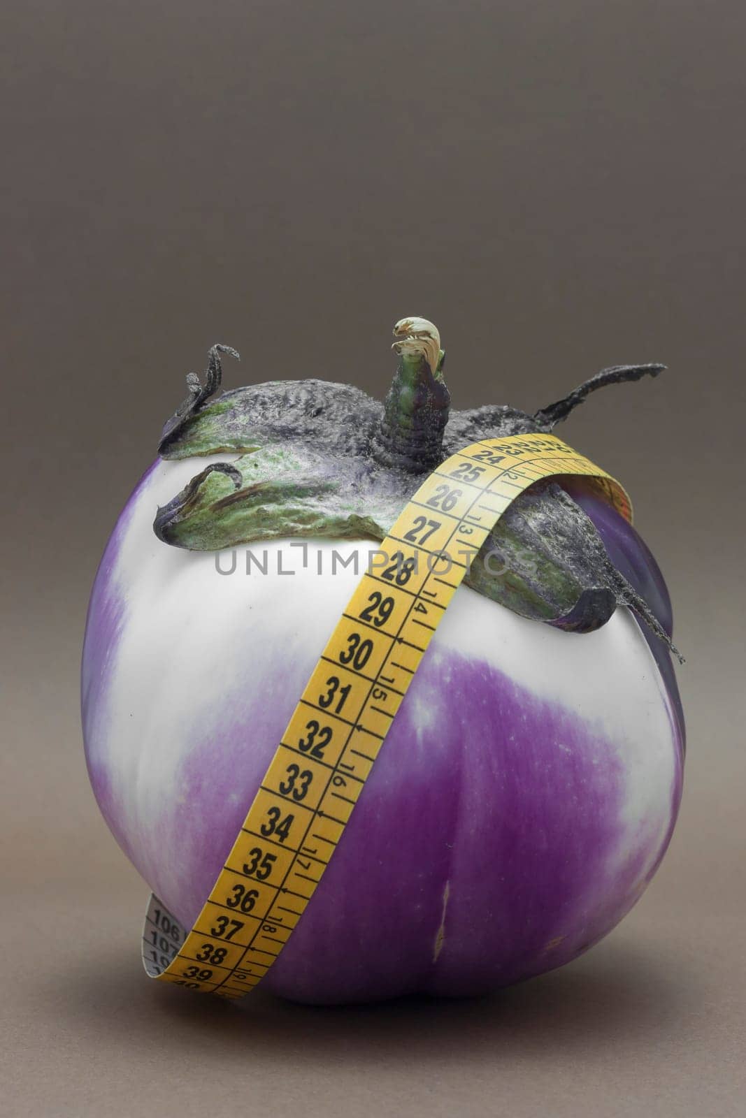 Fresh Ripe eggplant isolated on brown background to understand a concept of healthy eating
