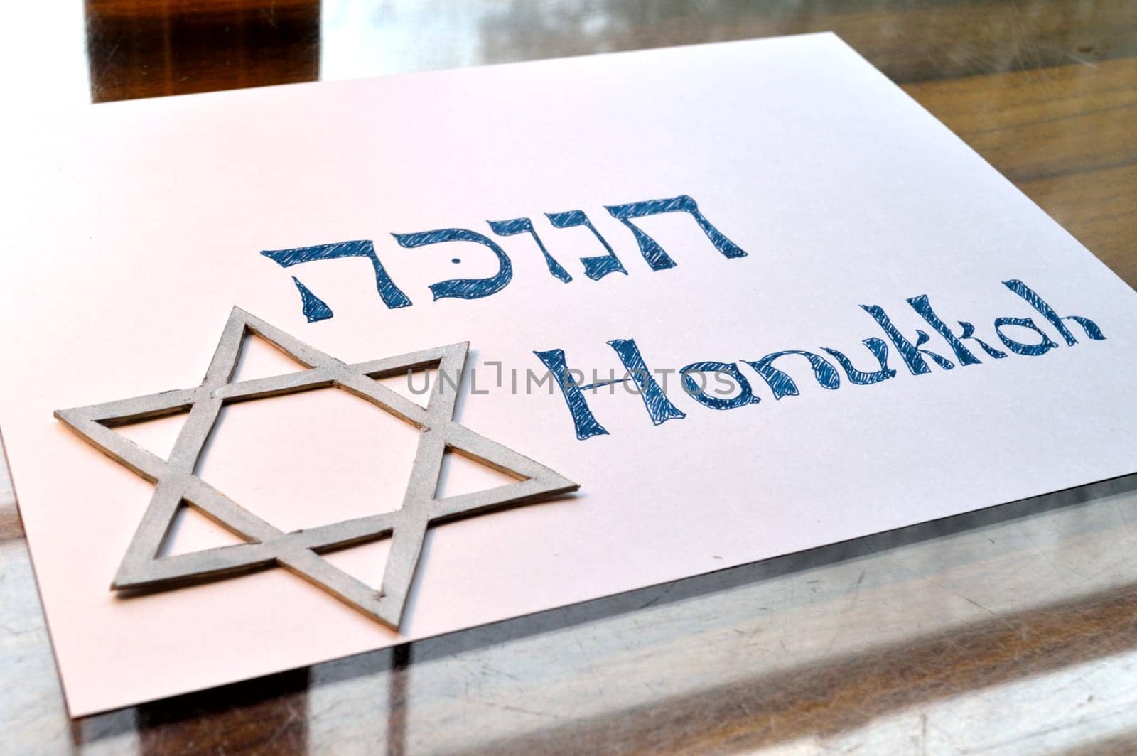Hebrew word "hanukkah"" or ""chanukah"". Jewish holiday, festival of lights. With Star of David."