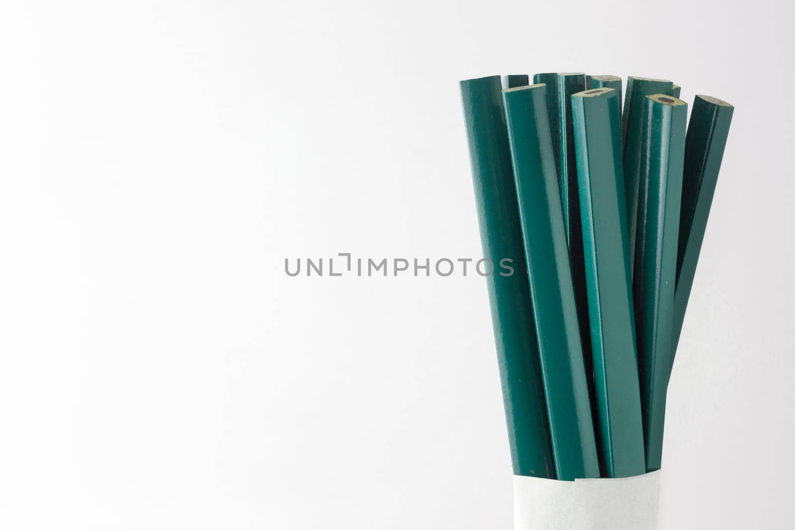 Pencils carpenter and construction worker on white background