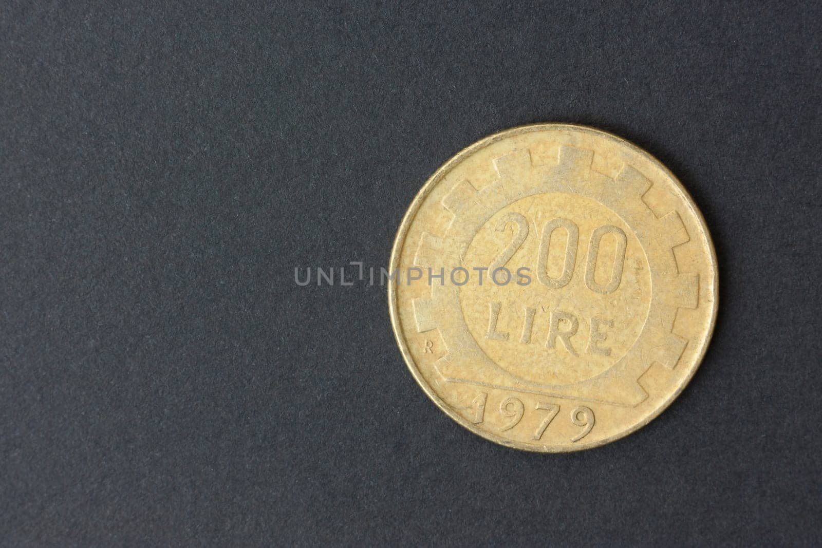 Two hundred Italian lire on a black background