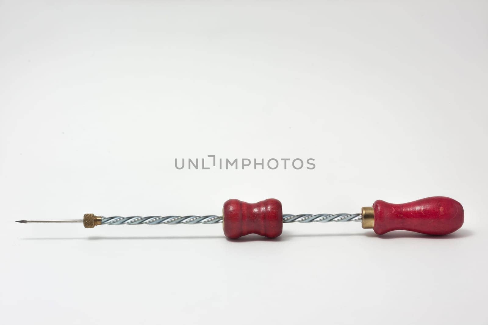 Hand drill with wood handle red isolated on white background