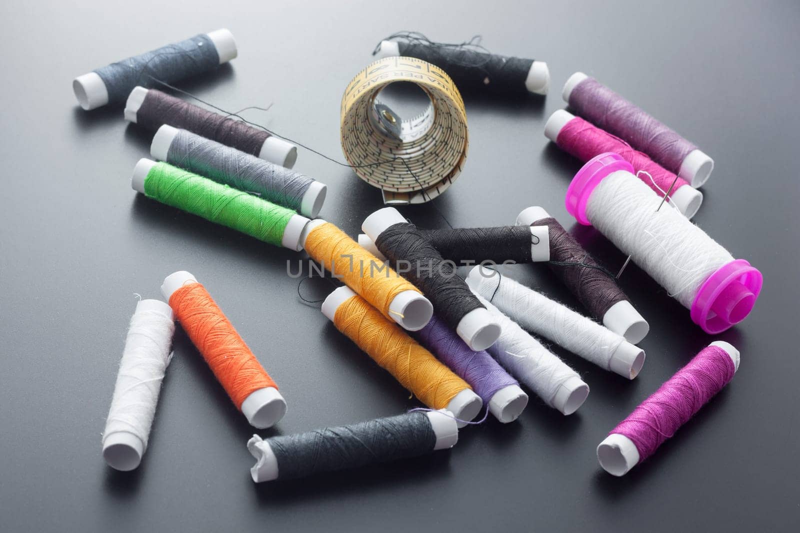 Spool of thread and pins. Sewing accessories