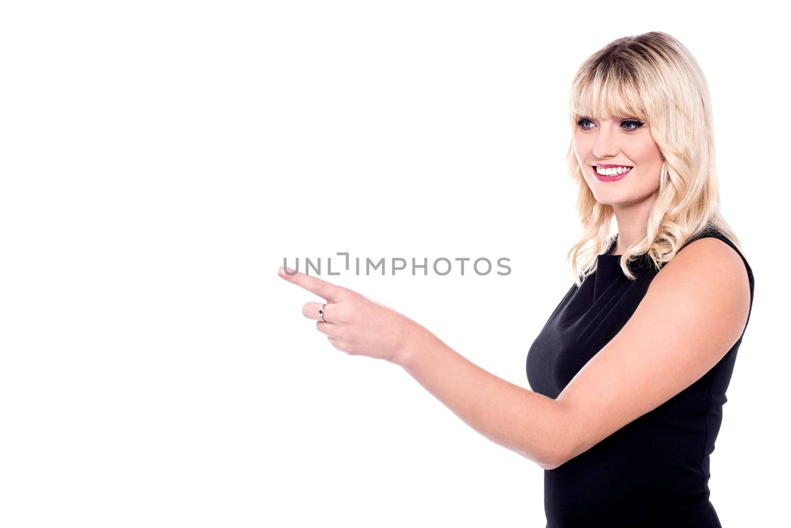 Cheerful lady pointing out something