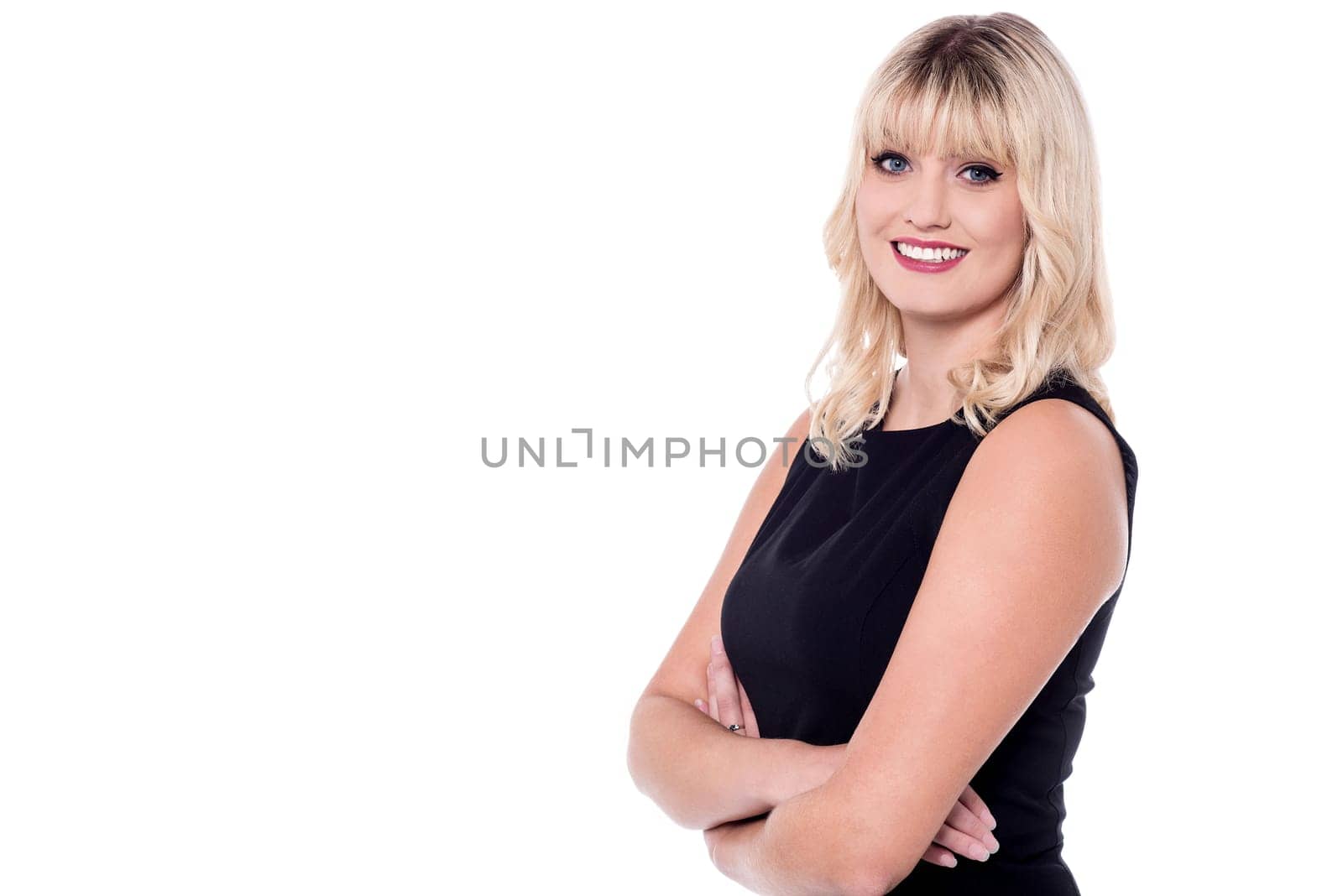 Pretty fashion woman posing with folded arms