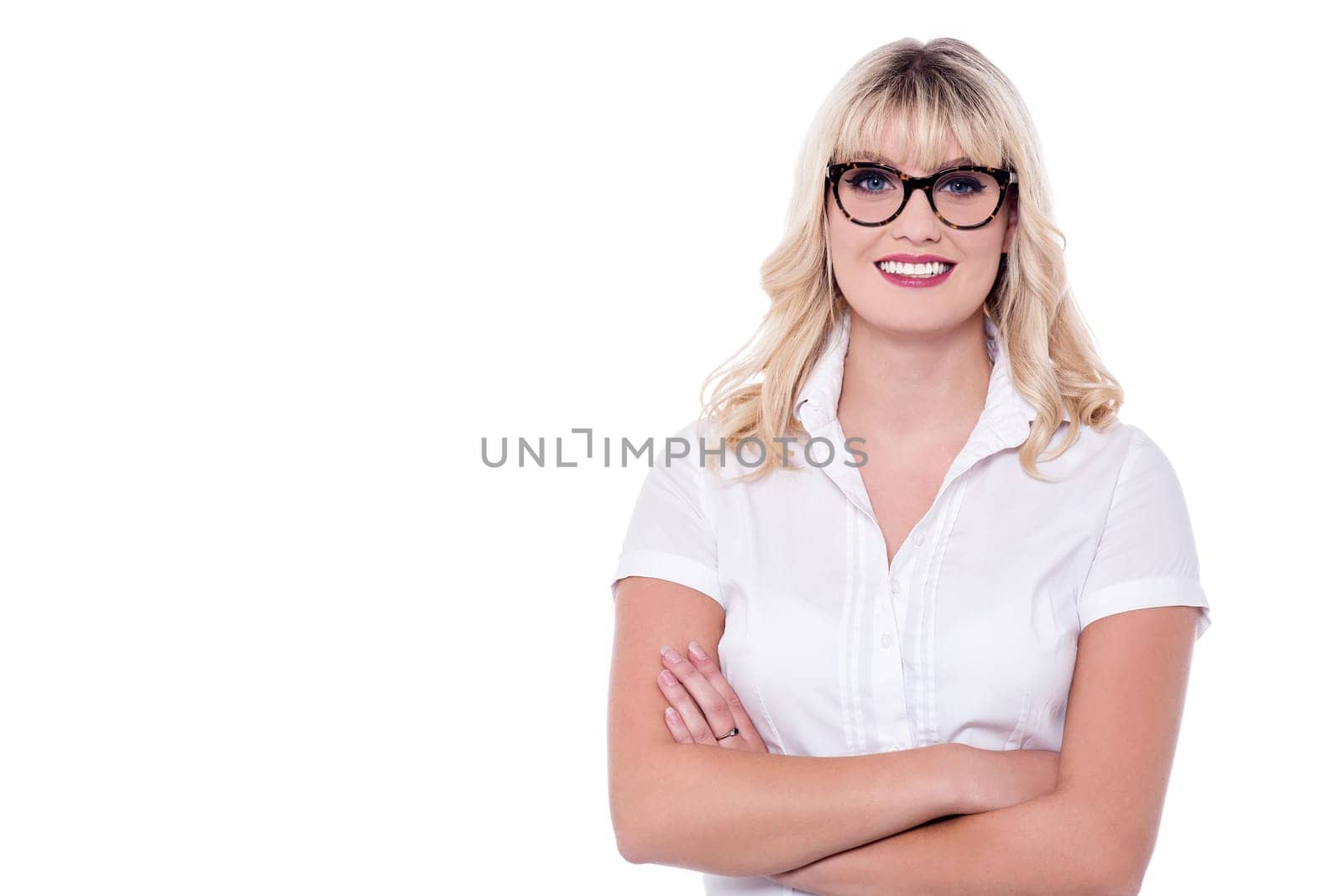 Young charming business lady, arms crossed.