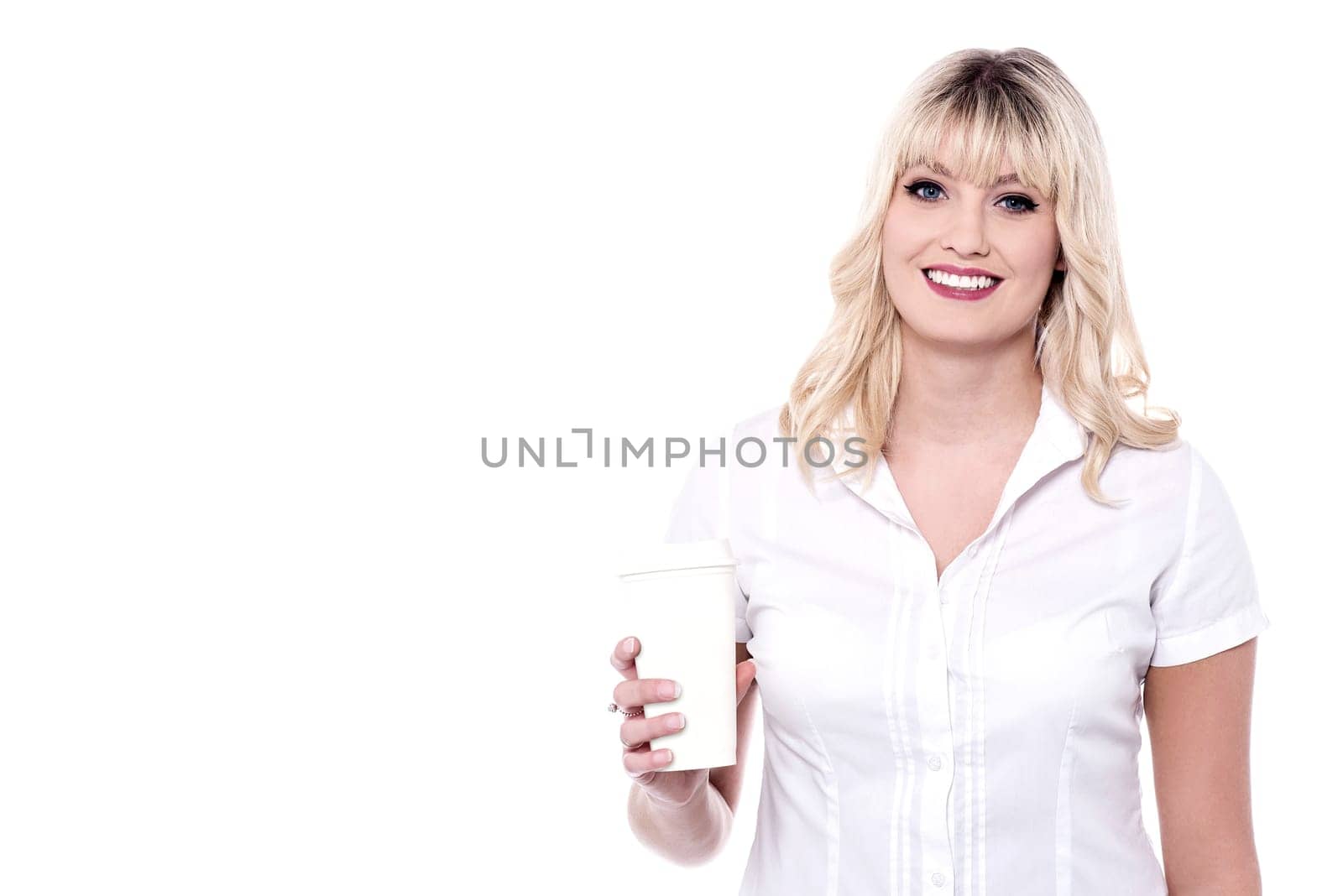 Smiling woman holding glass of beverage