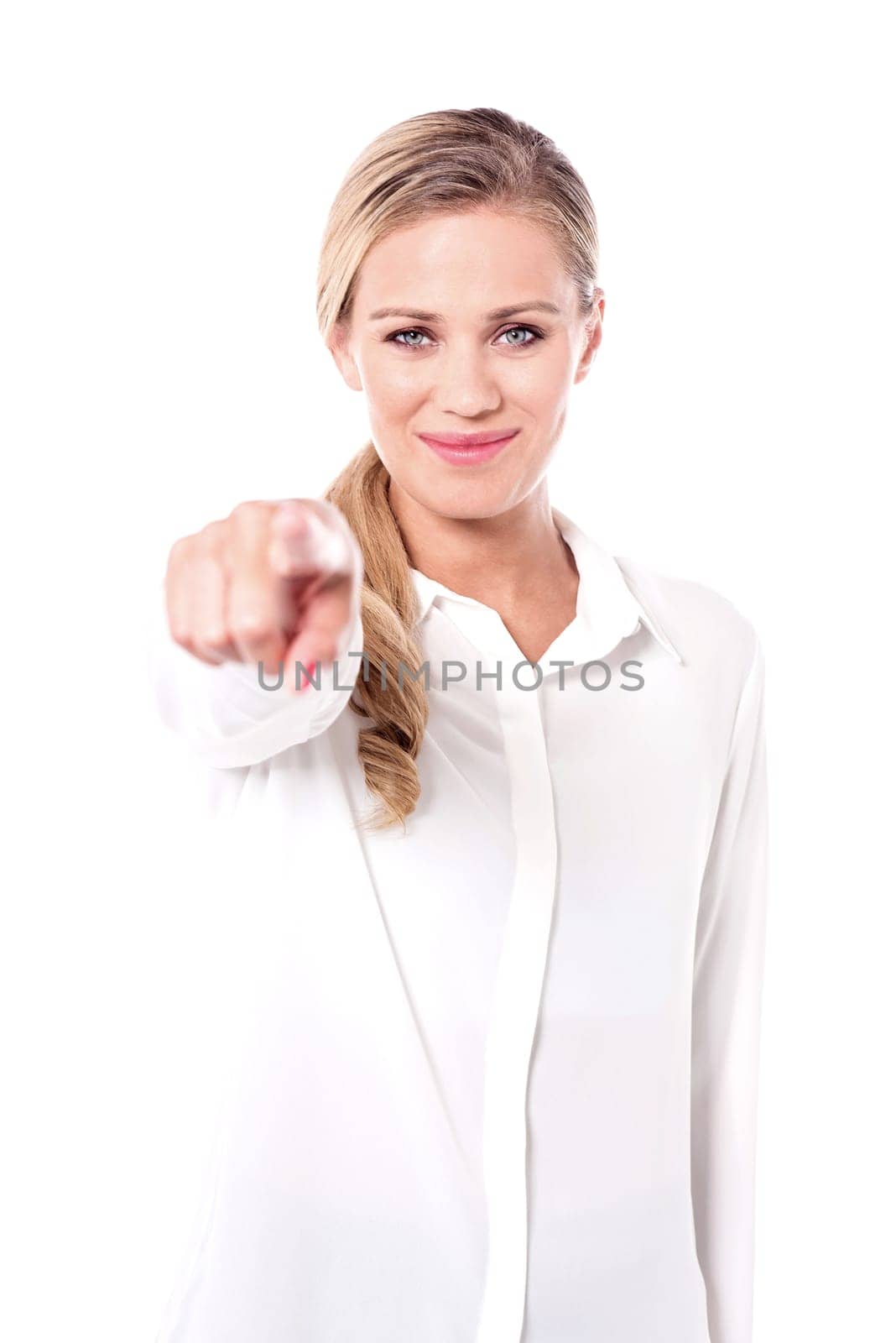 Lady pointing towards camera, half length shot.