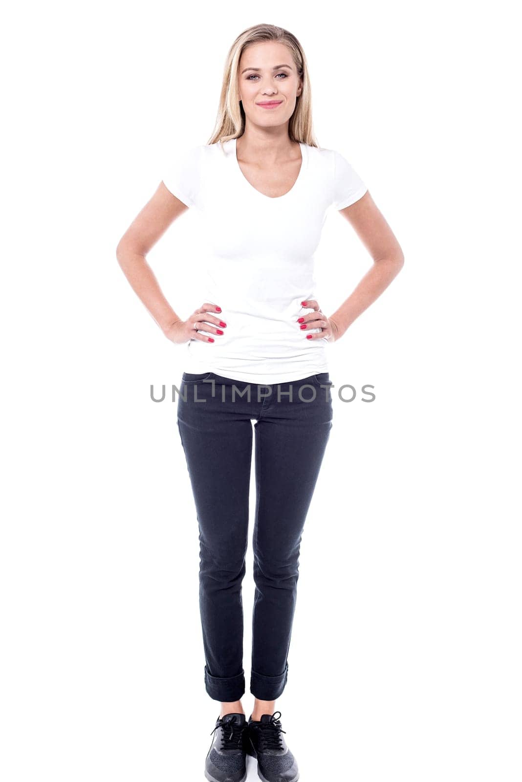 Young fit slim lady with hands on waist